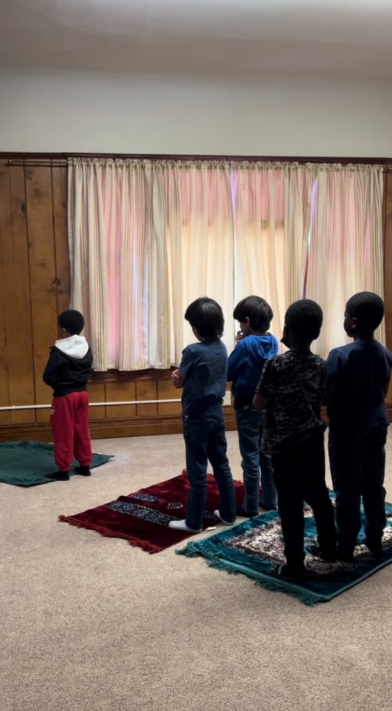 Students in prayer at Masjid Al-Mumin